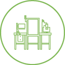 Line drawing of a minimalist office setup inside a green circle. Features a desk with a computer monitor, keyboard, and other small items. The design is simple, with a focus on technology and organization.