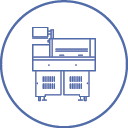 Icon of a laboratory machine inside a blue circle. The machine has a boxy design with cabinets below and a small screen attached at the top.