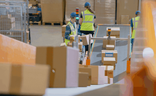 A group of people in a warehouse.