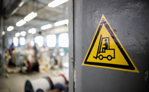 Yellow,Sign,In,A,Warehouse,,Production,-,Forklift,Works