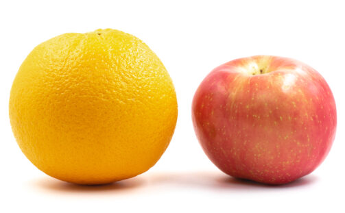Red,Apple,And,Orange,On,A,White,Background.